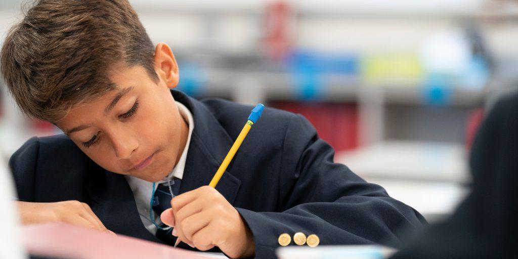 student working at a desk, private school, tampa fla